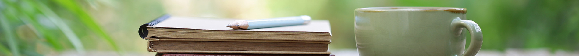 mug and book on a table outdoors